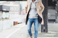 With brown coat, skinny jeans and beige boots