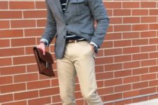 With cap, gray jacket, beige pants, brown bag and lace up boots
