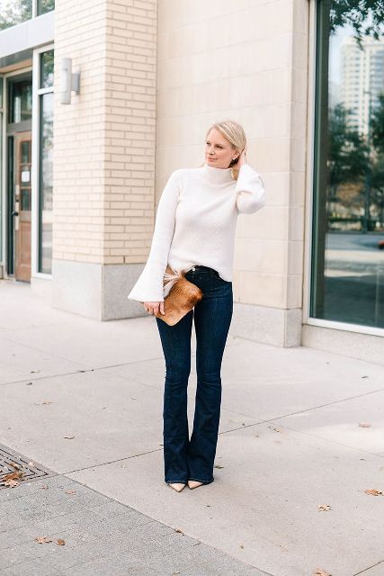 With flare pants, brown leather clutch and beige shoes
