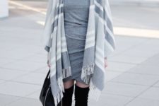 With gray dress, black bag and black over the knee boots