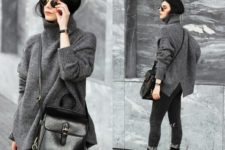 With gray loose sweater, skinny pants and black leather bag