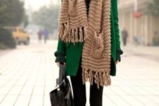 With green coat, oversized scarf, black dress and bag
