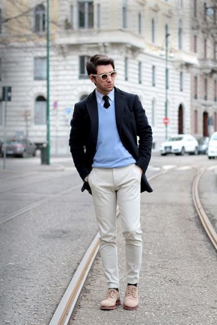With light blue shirt, black tie, black blazer, white pants and pastel colored shoes