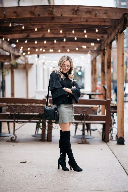 With mini skirt, black bag and black over the knee boots