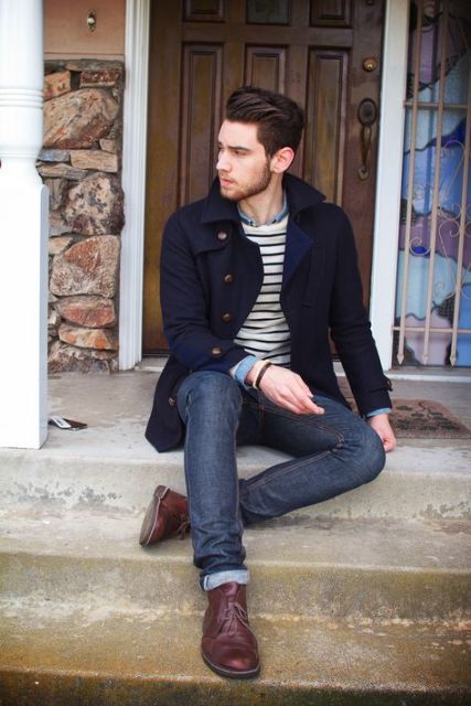 With navy blue jacket, jeans and boots