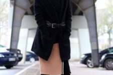 With over the knee boots, black sweater, black cardigan and belt