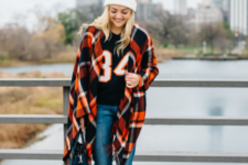 With pom pom hat, sweatshirt, cuffed jeans, flat shoes and bag