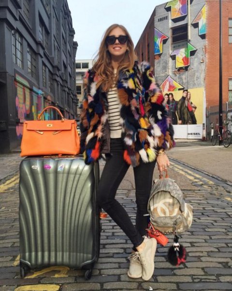 With striped shirt, jeans and colorful fur coat