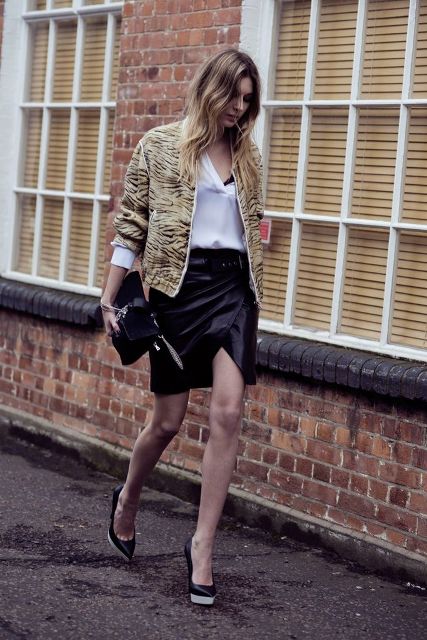 With white shirt, printed jacket, black clutch and platform shoes