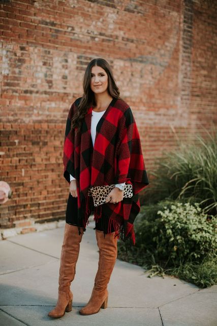 With white t-shirt, black skinny pants, brown suede over the knee boots and leopard clutch
