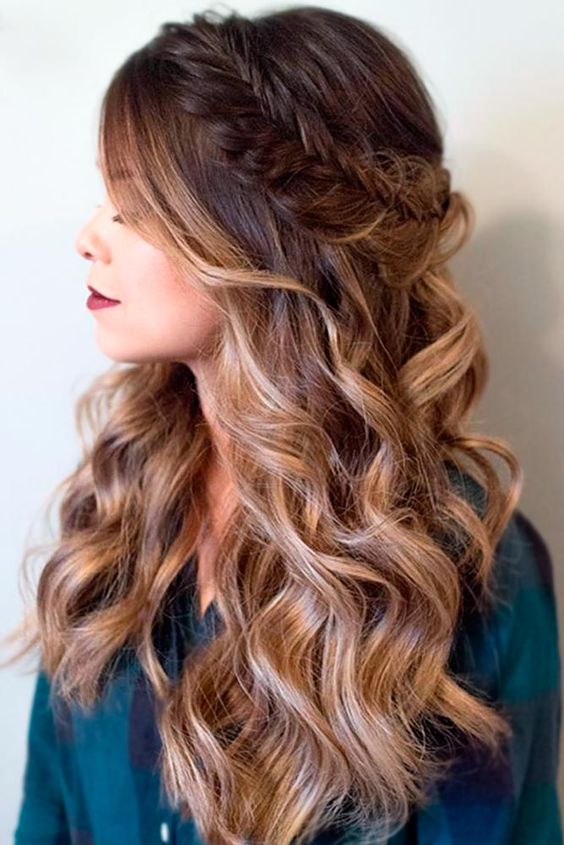 a beautiful half updo with a fishtail braided halo and waves down, with a sligth ombre effect for a party