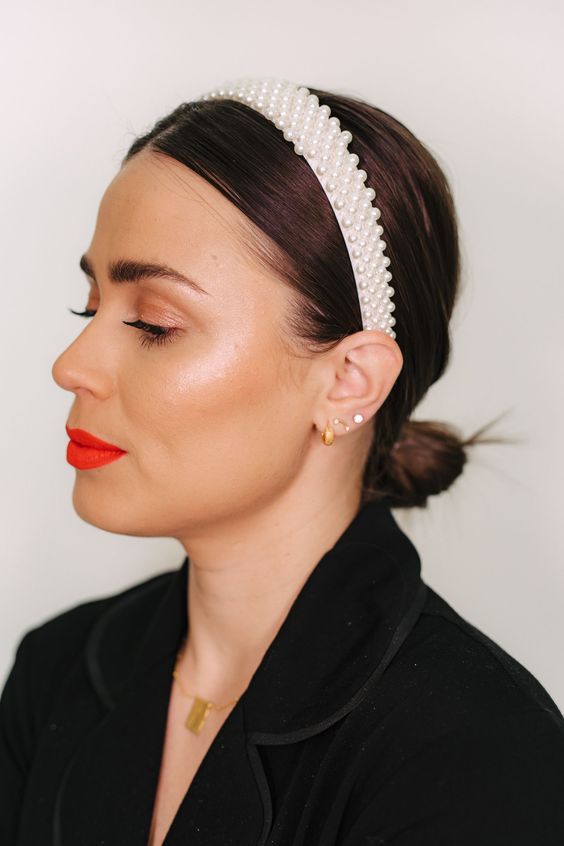 a cool and easy holiday hairstyle, a low bun with a sleek top, a pearl headband is lovely for Christmas