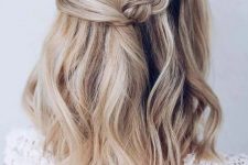 a cool blonde medium length half updo with a side braid and waves down is a stylish idea for a boho party look