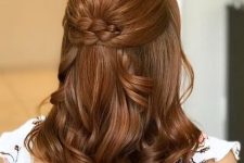 a holiday half updo for medium hair, with a bump on top, a braided touch and waves on the ends is a lovely idea