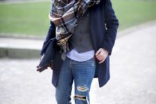 a stylish look with ripped denim, cognac boots, a white tee, a grey waistcoat, a plaid scarf and a navy short coat