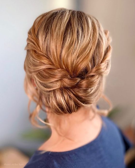 a twisted updo with a braided halo is a catchy and stylish idea