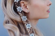a unique half updo with two side braids and little snowflakes plus waves down is a cool idea for the holidays