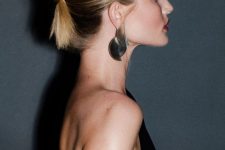 an elegant twisted chignon on medium-length hair, with a sleek top is a chic and cool solution to go for