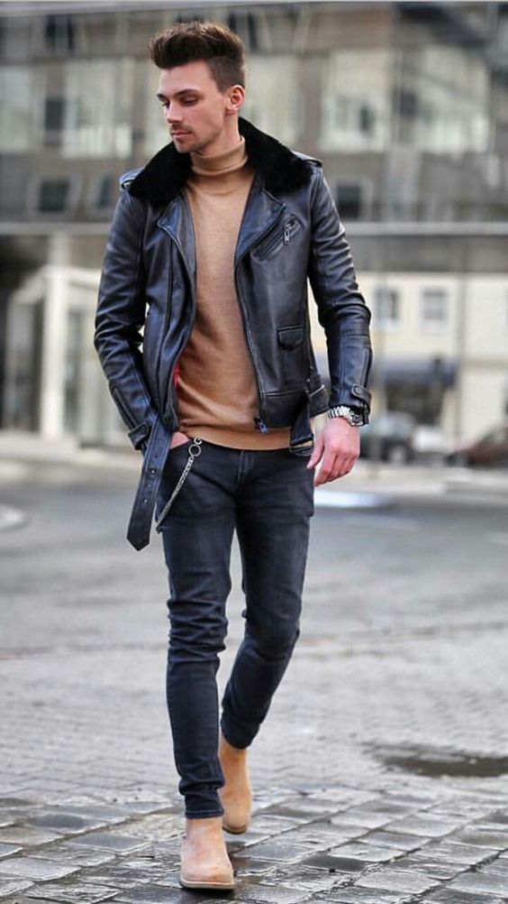 an outfit with a touch of rock, black jeans, a camel turtleneck, camel boots, a black leather jacket with a fur collar