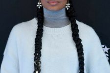 two long braids accented with pearls and pearl earrings are a great hairstyle for Christmas