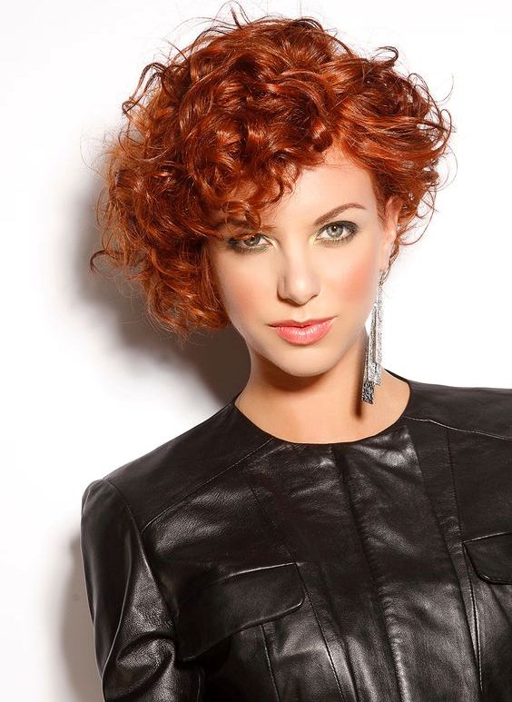 natural copper curly hair cut short looks very dimensional and very bold catching an eye
