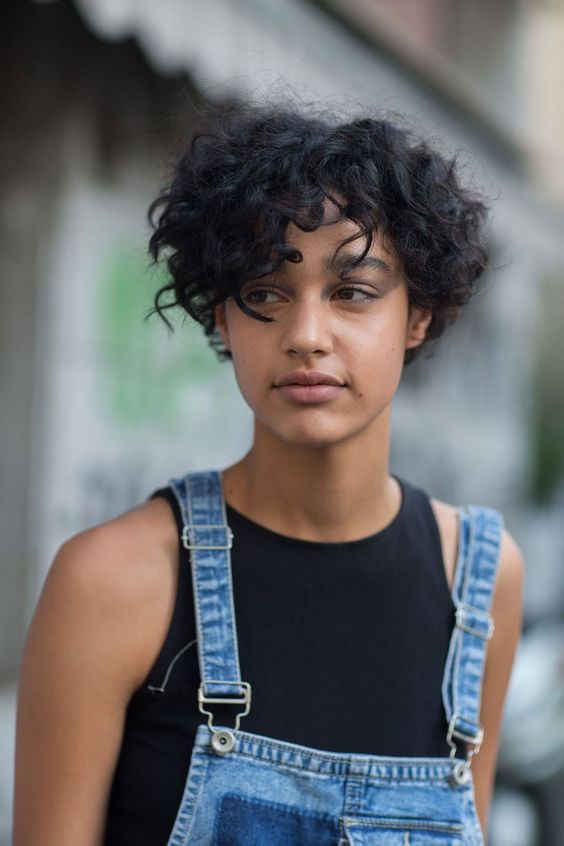 a super short curly bob or a long curly pixie is a daring and quirky idea to rock