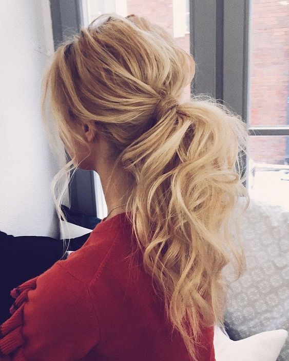 a complicated ponytail with a messy bump and wavy hair down can be worn to work and then to a date