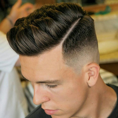 a short quiff with a mid fade works well and gives and option to add a hard part