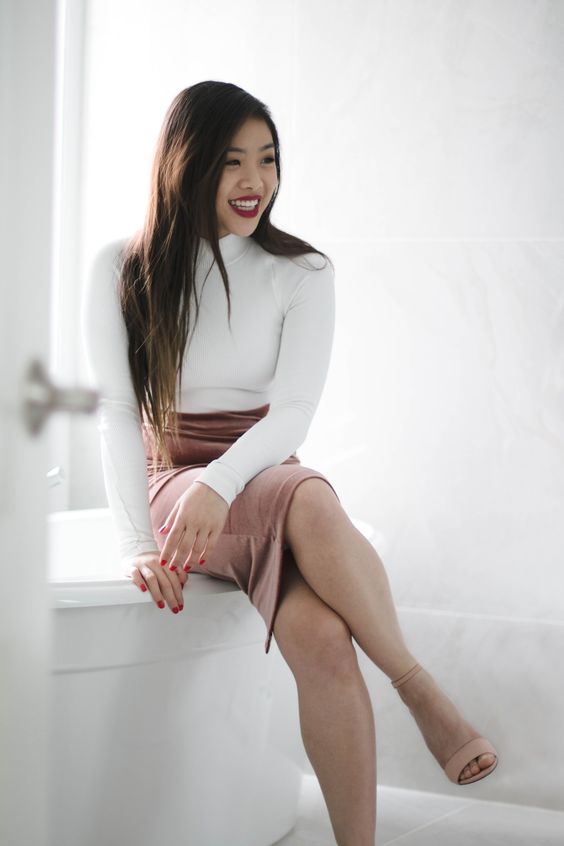 pull off a simple yet sexy look with a white turtleneck, a dusty pink pencil skirt and blush shoes