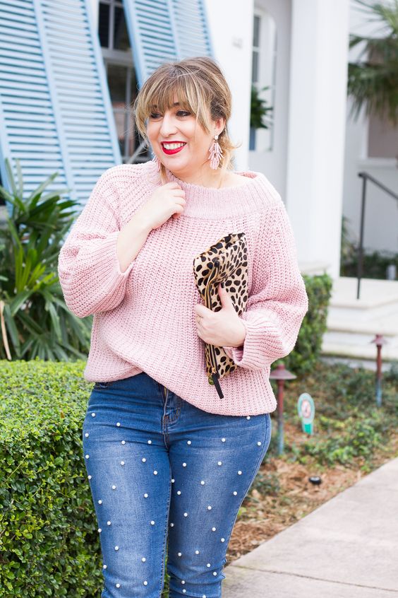 a casual and tender look with a blush one shoulder sweater, pearly denim, a leopard clutch