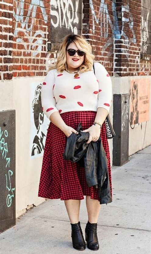 a cool look with a lip long sleeve shirt, a plaid midi skirt, black boots and a black leather jacket is suitable for Valentine's Day