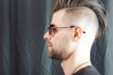14 a mohawk hairstyle with a few inches of hair above the neckline and and long hair up
