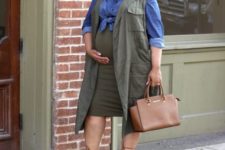 16 an olive pencil skirt, a chambray shirt, an olive green long vest, a brown bag and strappy heels