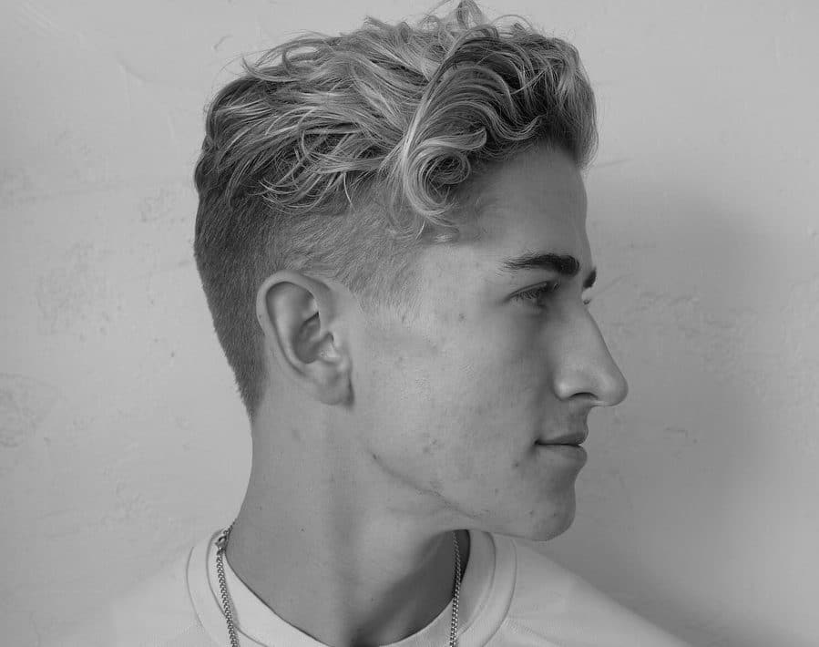 give your naturally curly hair a hint of surfer style with a side curly haircut