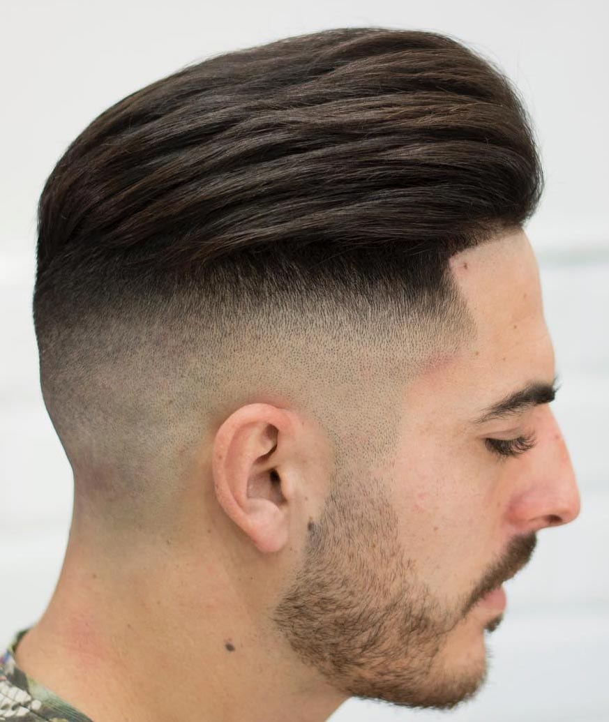 High skin fade with a line up is a modern and stylish idea to rock if you love longer hair