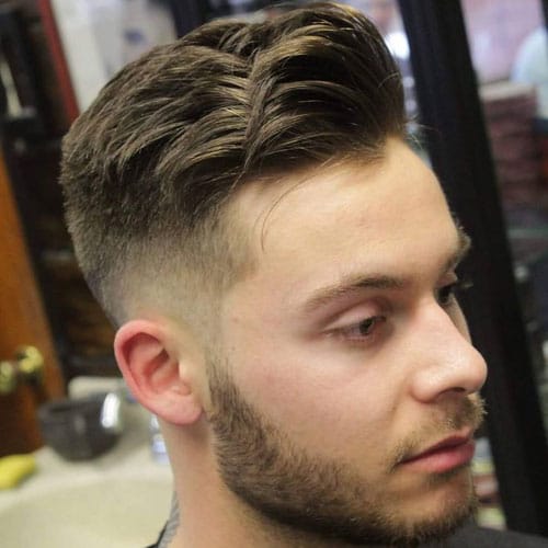 this mid fade haircut plus a long top is a stylish idea with a relaxed feel