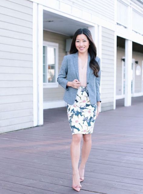 With beige top, gray blazer and pale pink pumps