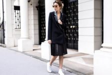 With black blazer and white sneakers