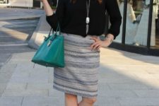 With black blouse, emerald bag and beige pumps