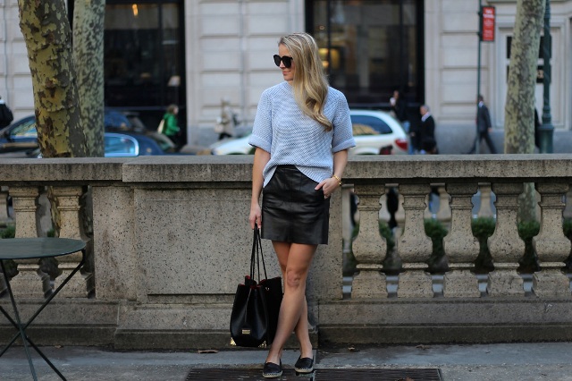 With black leather skirt, black tote and flat shoes