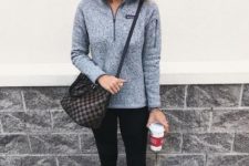 With black leggings, white and pink sneakers and printed bag