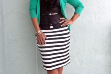 With black top, green cardigan and ankle strap shoes