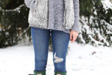 With gray loose sweater, skinny jeans and green high boots
