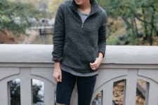 With gray t-shirt, distressed pants and ankle boots