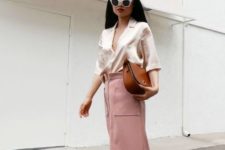 With pale pink midi skirt, brown bag and platform shoes