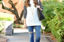 With striped shirt, distressed jeans, black tote and brown ankle boots