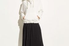 With white t-shirt, black pleated midi skirt and white mules