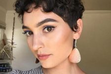 a bold curly pixie