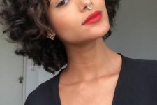 a black chin-length bob with curls is a cool and catchy idea, it looks bold and eye-catchy