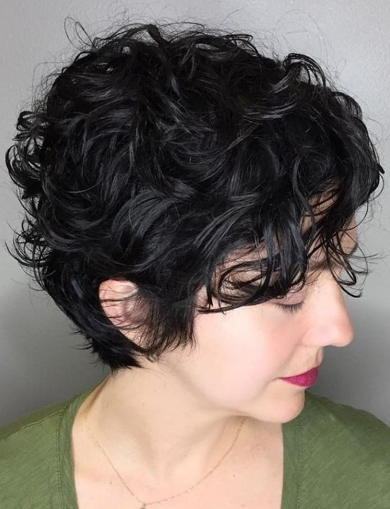 a delightful long black wavy pixie haircut with messy wavy bangs is a super cool and fresh solution to rock